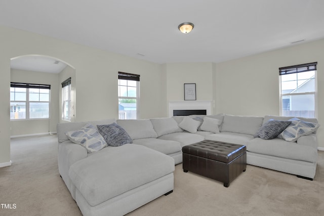 5824 Lady Way, Hope Mills, NC 28348 - living area featuring carpet flooring, arched walkways, and baseboards