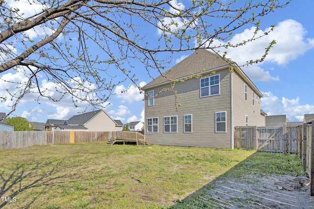 5824 Lady Way, Hope Mills, NC 28348 - back of property featuring a wooden deck, a fenced backyard, and a lawn