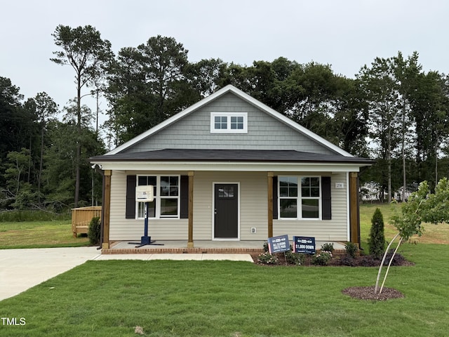 274 Longbow Dr, Middlesex, NC 27557 - view of front of house featuring covered porch and a front yard