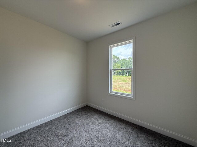 274 Longbow Dr, Middlesex, NC 27557 - unfurnished room with baseboards and dark colored carpet