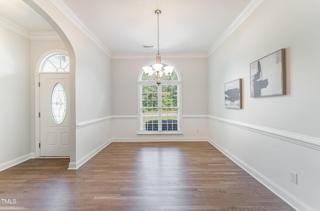 315 Copper Ridge Dr, Sanford, NC 27330 - foyer with visible vents, arched walkways, an inviting chandelier, ornamental molding, and wood finished floors