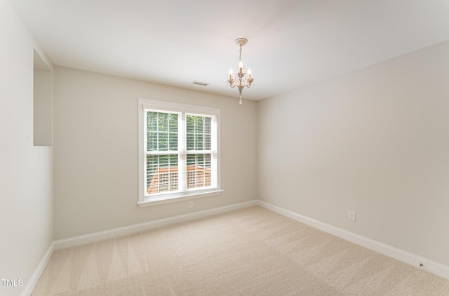 315 Copper Ridge Dr, Sanford, NC 27330 - empty room with carpet, visible vents, a chandelier, and baseboards