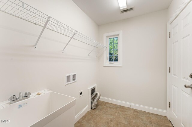315 Copper Ridge Dr, Sanford, NC 27330 - washroom featuring electric dryer hookup, visible vents, baseboards, hookup for a washing machine, and laundry area