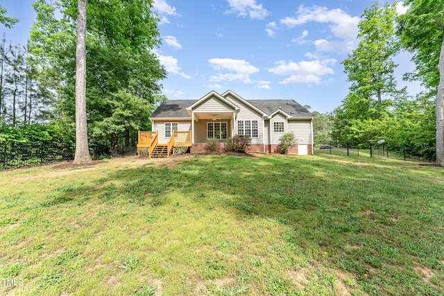 315 Copper Ridge Dr, Sanford, NC 27330 - view of front of home with a front lawn, crawl space, a wooden deck, and a fenced backyard