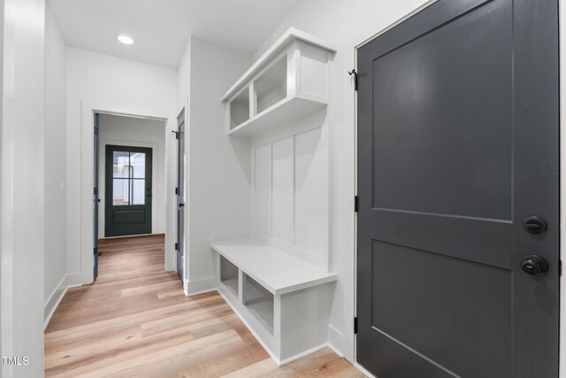 mudroom featuring baseboards, light wood-style floors, and recessed lighting