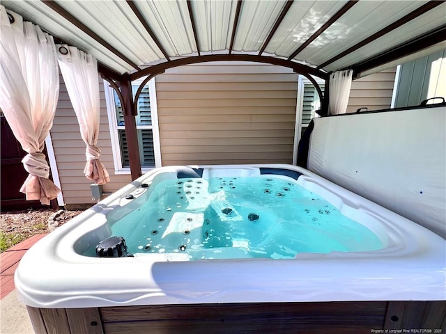 exterior space featuring a jacuzzi