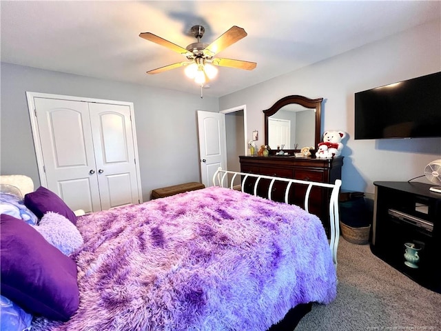 carpeted bedroom featuring a closet and a ceiling fan