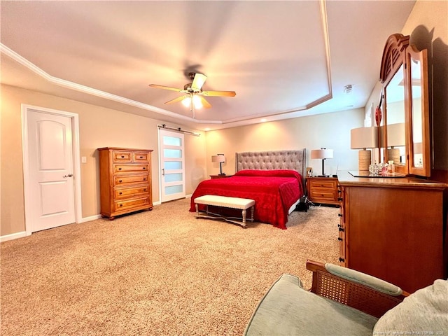 bedroom with carpet flooring, ceiling fan, baseboards, and a raised ceiling