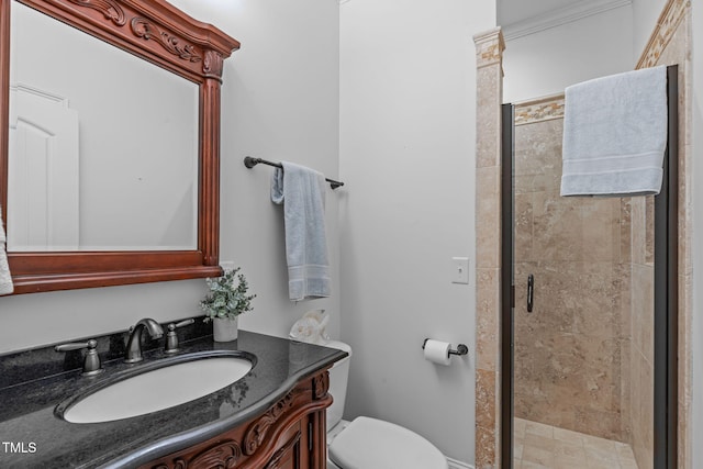 bathroom featuring a shower stall, vanity, and toilet