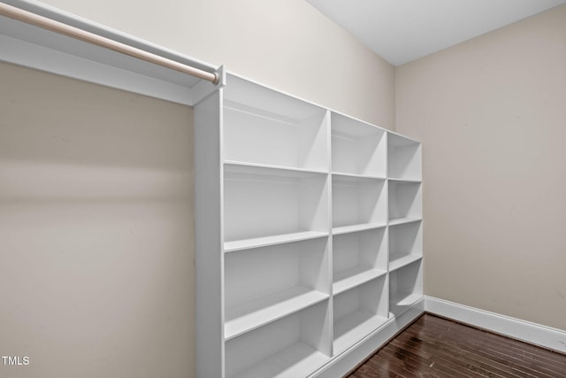details with baseboards and wood finished floors