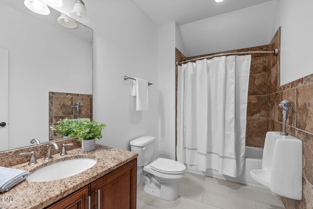 bathroom with toilet, shower / bath combo, vanity, and tile patterned flooring