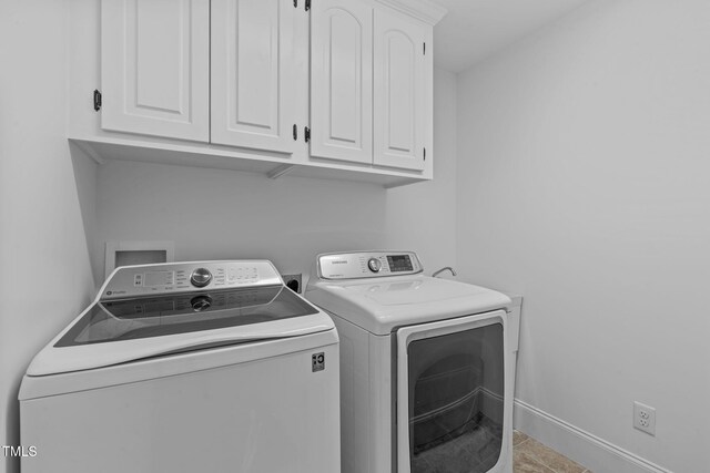 2408 Merion Creek Dr, Apex, NC 27539 - laundry room featuring washer and clothes dryer, cabinet space, and baseboards