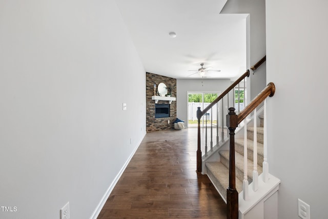 122 Torpoint Rd, Durham, NC 27703 - stairway featuring ceiling fan, a fireplace, and wood finished floors