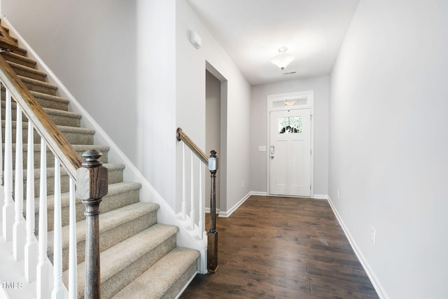 122 Torpoint Rd, Durham, NC 27703 - foyer with dark wood-style floors and stairway