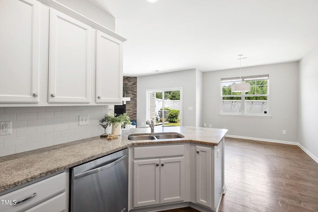 122 Torpoint Rd, Durham, NC 27703 - kitchen with dishwasher, a peninsula, backsplash, and white cabinetry