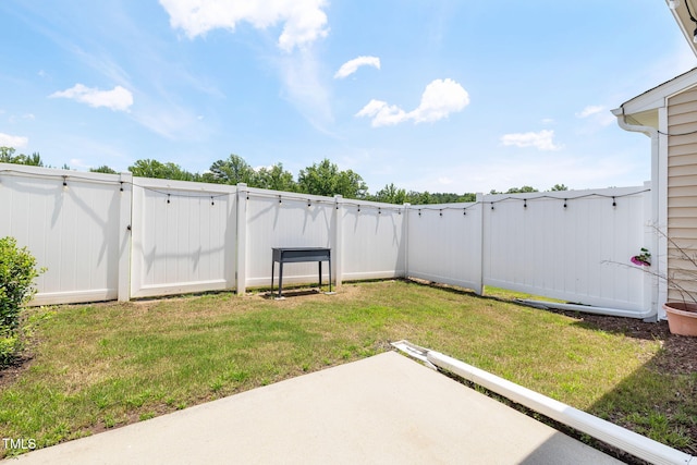 122 Torpoint Rd, Durham, NC 27703 - fenced backyard with a gate and a patio area