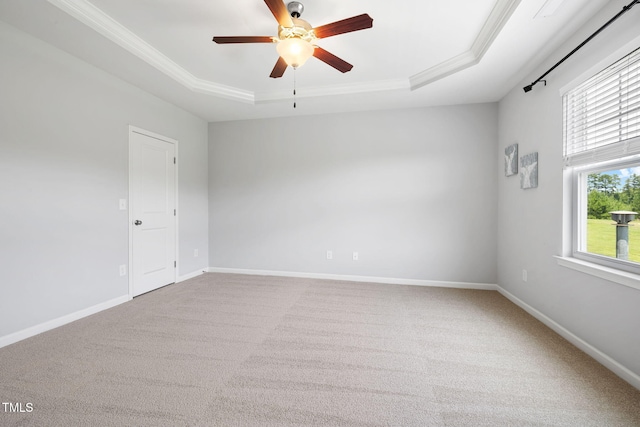 122 Torpoint Rd, Durham, NC 27703 - spare room with a raised ceiling, carpet flooring, ornamental molding, and ceiling fan