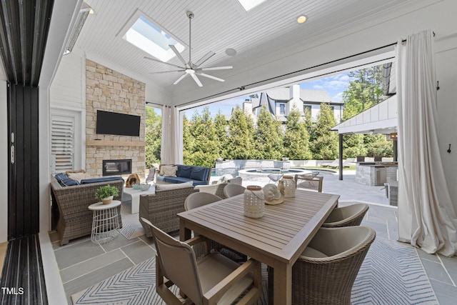 1208 Hunting Ridge Rd, Raleigh, NC 27615 - view of patio / terrace with an outdoor kitchen, an outdoor living space with a fireplace, outdoor dining area, and ceiling fan