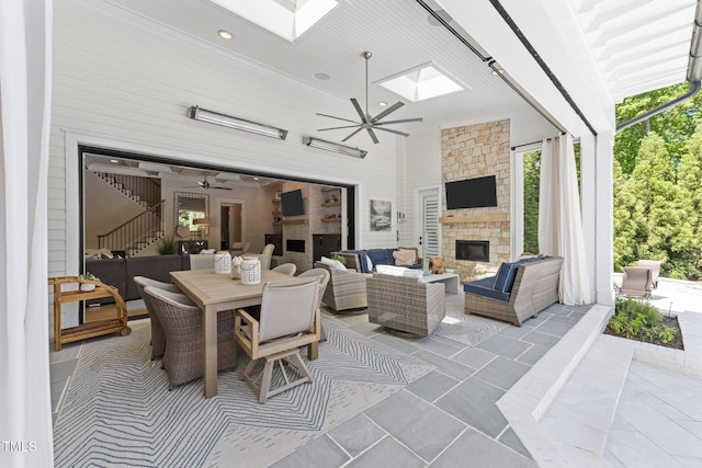 1208 Hunting Ridge Rd, Raleigh, NC 27615 - view of patio / terrace featuring a ceiling fan and an outdoor living space with a fireplace