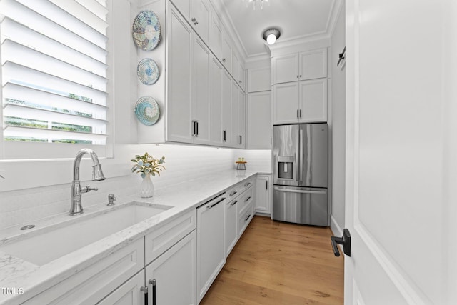 1208 Hunting Ridge Rd, Raleigh, NC 27615 - kitchen with stainless steel fridge with ice dispenser, a sink, white cabinets, backsplash, and light stone counters
