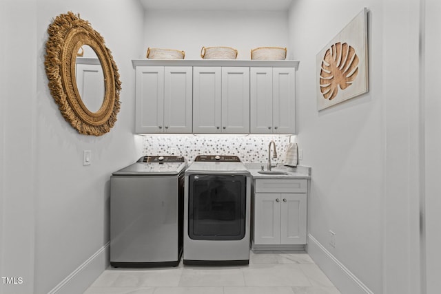 1208 Hunting Ridge Rd, Raleigh, NC 27615 - laundry area featuring independent washer and dryer, cabinet space, and baseboards