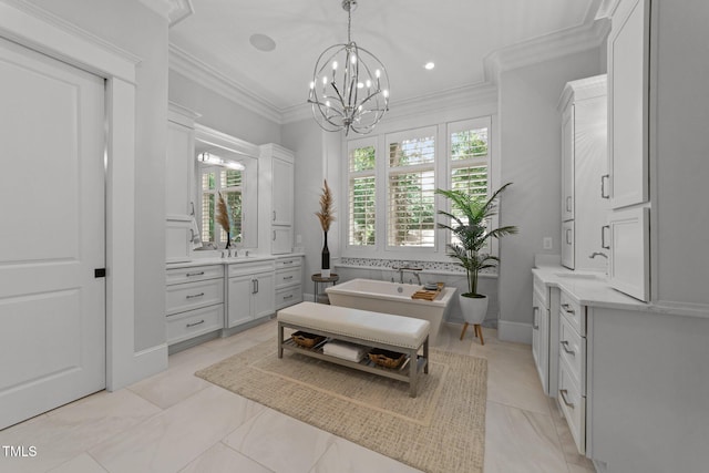 1208 Hunting Ridge Rd, Raleigh, NC 27615 - bathroom with two vanities, a chandelier, a soaking tub, ornamental molding, and recessed lighting