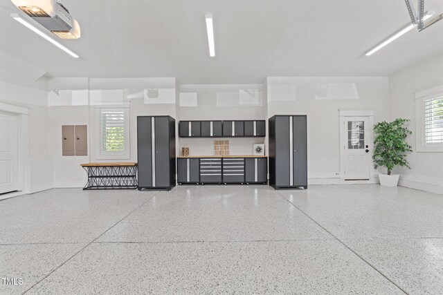 1208 Hunting Ridge Rd, Raleigh, NC 27615 - garage featuring baseboards
