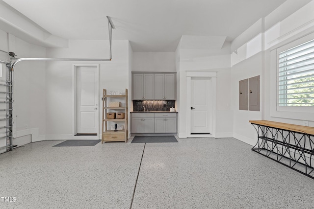 1208 Hunting Ridge Rd, Raleigh, NC 27615 - garage featuring baseboards and electric panel
