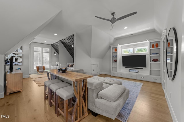 1208 Hunting Ridge Rd, Raleigh, NC 27615 - living room with lofted ceiling, plenty of natural light, light wood-type flooring, a ceiling fan, and baseboards