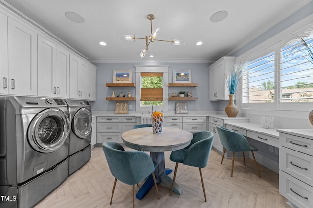 1208 Hunting Ridge Rd, Raleigh, NC 27615 - laundry area with cabinet space, crown molding, washing machine and clothes dryer, a chandelier, and recessed lighting