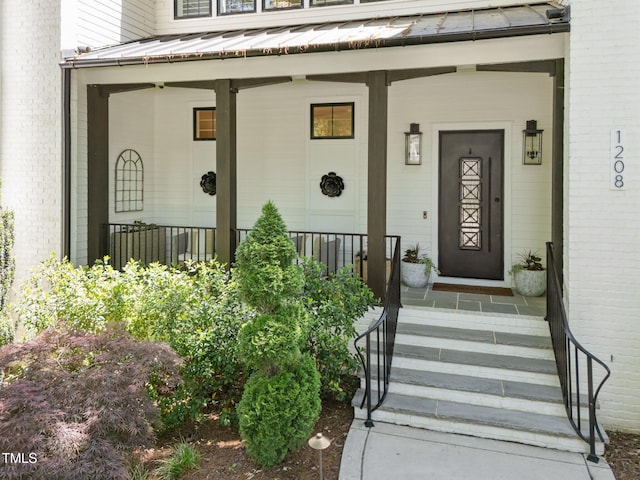 1208 Hunting Ridge Rd, Raleigh, NC 27615 - entrance to property featuring a standing seam roof, a porch, and metal roof