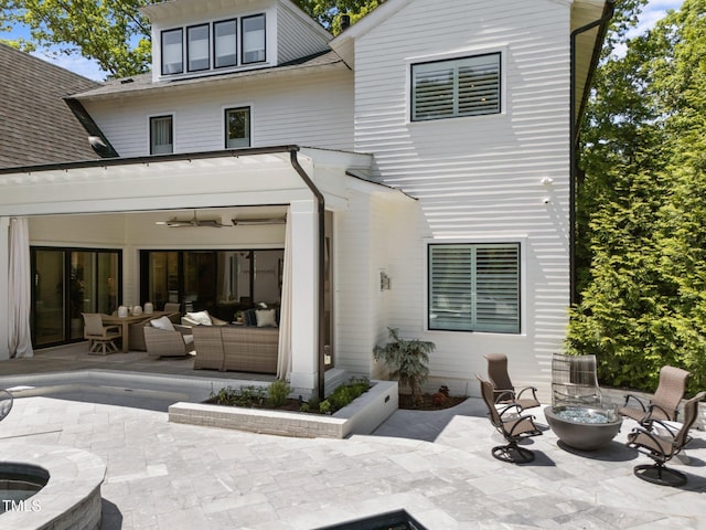 1208 Hunting Ridge Rd, Raleigh, NC 27615 - back of property with a patio area, an outdoor living space with a fire pit, and a ceiling fan