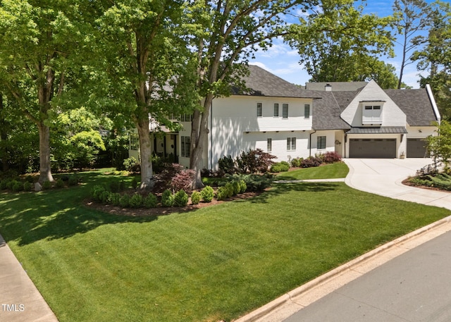 1208 Hunting Ridge Rd, Raleigh, NC 27615 - view of front of property with concrete driveway, a shingled roof, a front lawn, and an attached garage