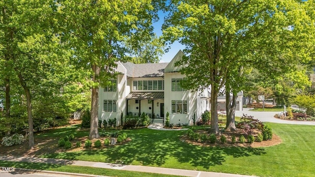 1208 Hunting Ridge Rd, Raleigh, NC 27615 - view of front of home featuring a front yard, driveway, and a shingled roof