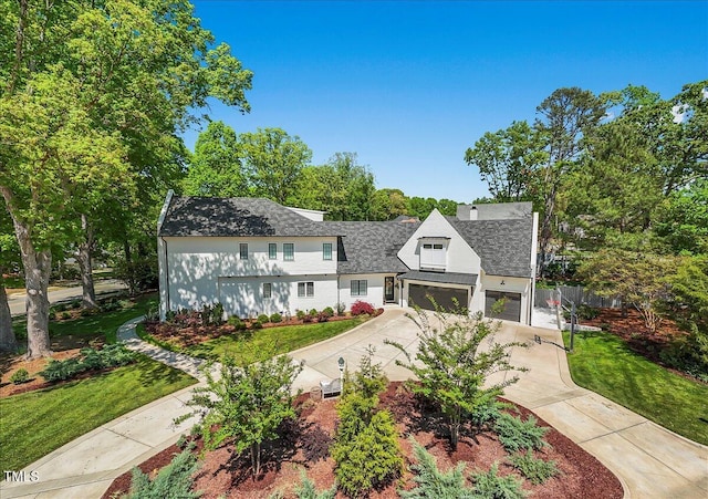 1208 Hunting Ridge Rd, Raleigh, NC 27615 - view of front of house featuring driveway, a shingled roof, and a garage
