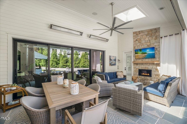 1208 Hunting Ridge Rd, Raleigh, NC 27615 - living room featuring a fireplace, a skylight, and ceiling fan