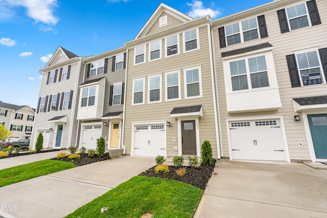 605 Silverado Sunset Loop, Wendell, NC 27591 - multi unit property with driveway, an attached garage, and a residential view