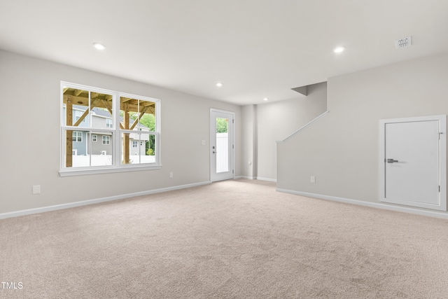 605 Silverado Sunset Loop, Wendell, NC 27591 - unfurnished living room featuring light colored carpet, recessed lighting, and baseboards