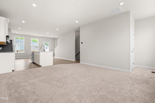 605 Silverado Sunset Loop, Wendell, NC 27591 - unfurnished living room featuring light colored carpet, recessed lighting, and baseboards