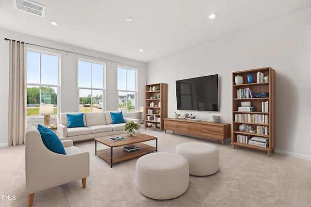 605 Silverado Sunset Loop, Wendell, NC 27591 - living room with light colored carpet, healthy amount of natural light, baseboards, and recessed lighting