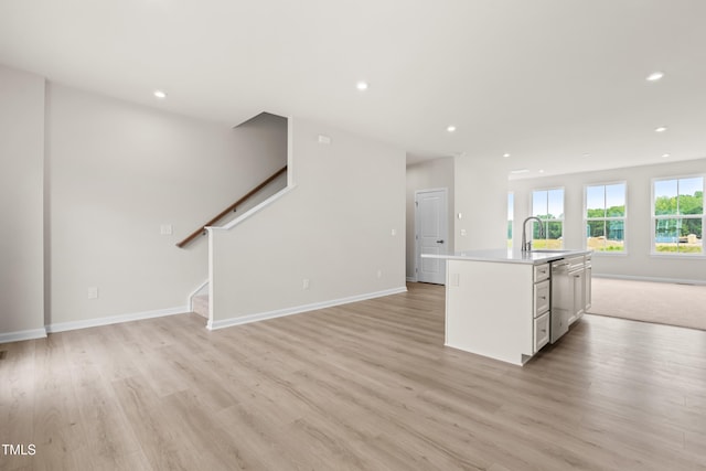 605 Silverado Sunset Loop, Wendell, NC 27591 - kitchen featuring open floor plan, dishwasher, light wood finished floors, a sink, and recessed lighting
