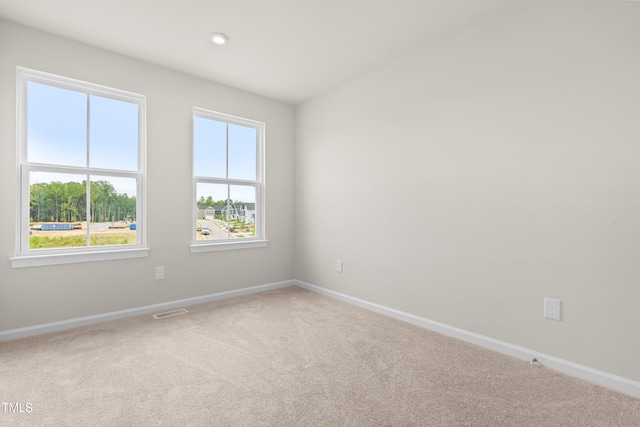 605 Silverado Sunset Loop, Wendell, NC 27591 - spare room featuring healthy amount of natural light, carpet, and baseboards