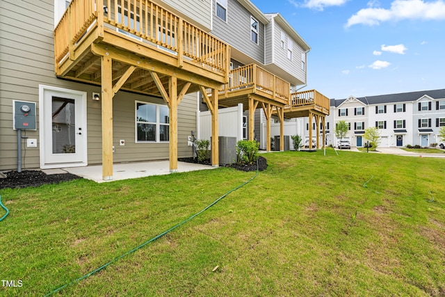 605 Silverado Sunset Loop, Wendell, NC 27591 - rear view of house with a wooden deck, a yard, a patio area, and a residential view