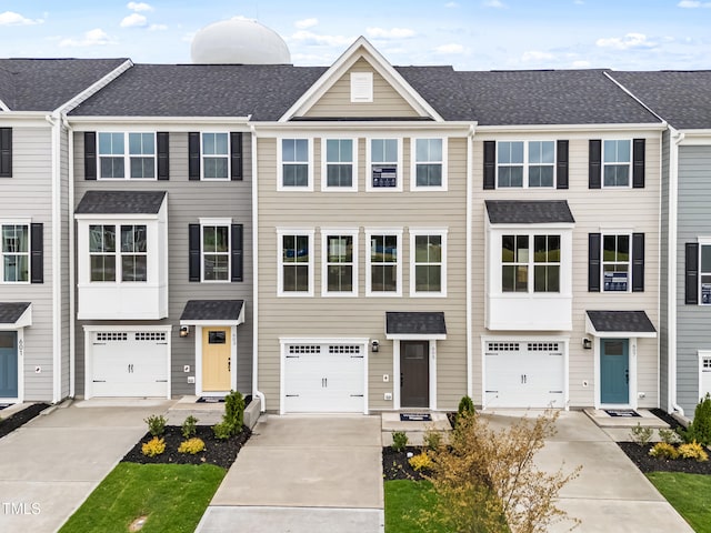 605 Silverado Sunset Loop, Wendell, NC 27591 - view of property featuring driveway, a shingled roof, and an attached garage