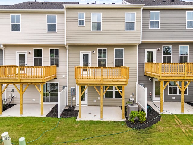 605 Silverado Sunset Loop, Wendell, NC 27591 - rear view of house with a patio area, cooling unit, and a lawn