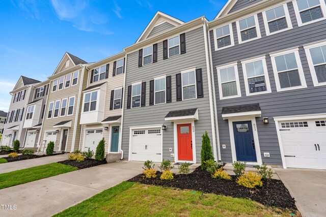 609 Silverado Sunset Loop, Wendell, NC 27591 - townhome / multi-family property with driveway and a residential view
