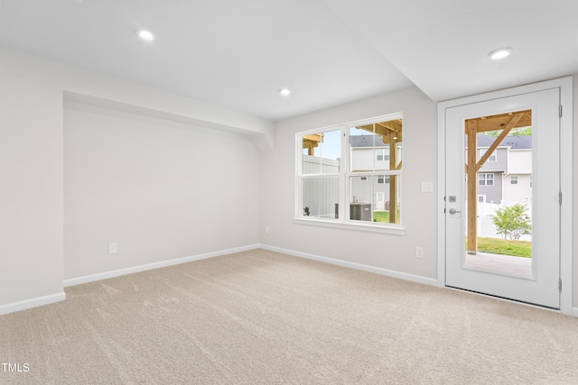 609 Silverado Sunset Loop, Wendell, NC 27591 - spare room featuring carpet floors, baseboards, plenty of natural light, and recessed lighting