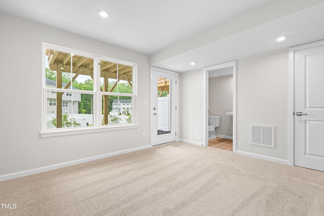 609 Silverado Sunset Loop, Wendell, NC 27591 - unfurnished bedroom featuring carpet, baseboards, access to outside, recessed lighting, and ensuite bathroom