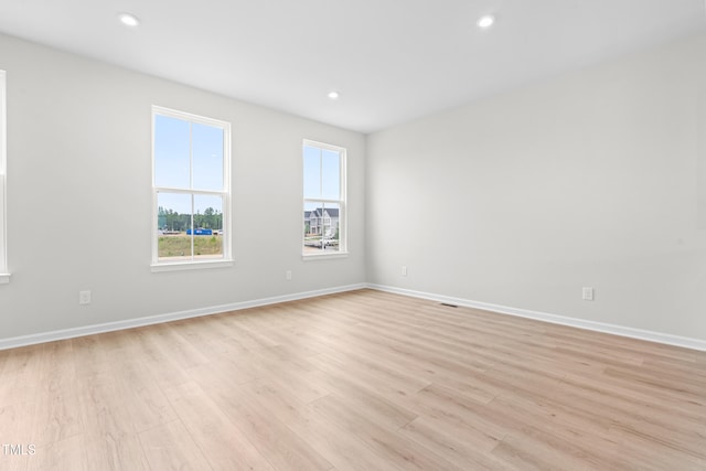 609 Silverado Sunset Loop, Wendell, NC 27591 - unfurnished room with light wood-style flooring, baseboards, and recessed lighting