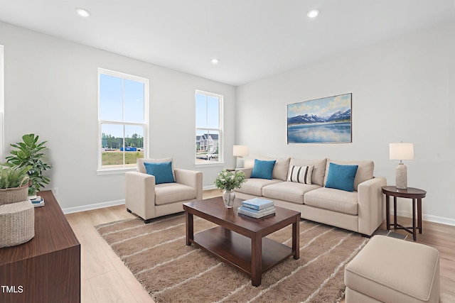 609 Silverado Sunset Loop, Wendell, NC 27591 - living room with wood finished floors, baseboards, and recessed lighting
